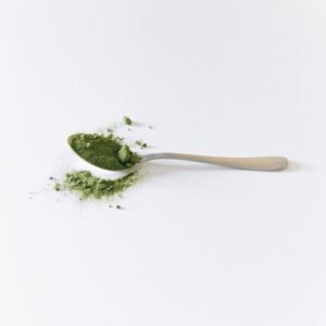 Green tea leaf powder on a spoon